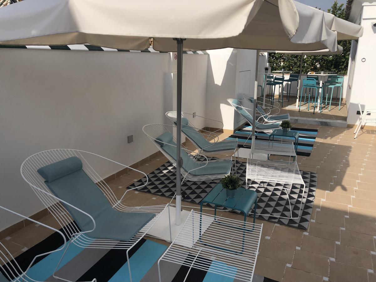 Uma Suites Parada Del Marques Sevilla Bagian luar foto