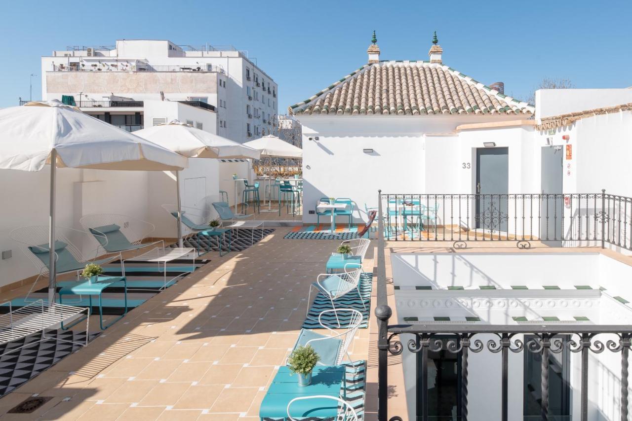 Uma Suites Parada Del Marques Sevilla Bagian luar foto